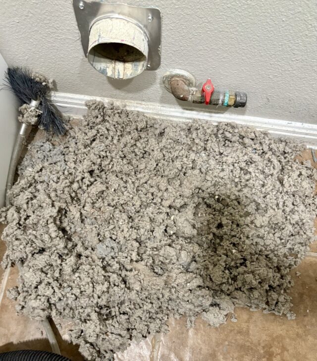 Extreme dryer vent lint buildup removed during professional dryer vent cleaning in an Austin TX home.