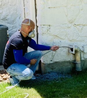 Andrew performing a professional dryer vent cleaning service in Austin, TX to improve airflow and reduce fire risk