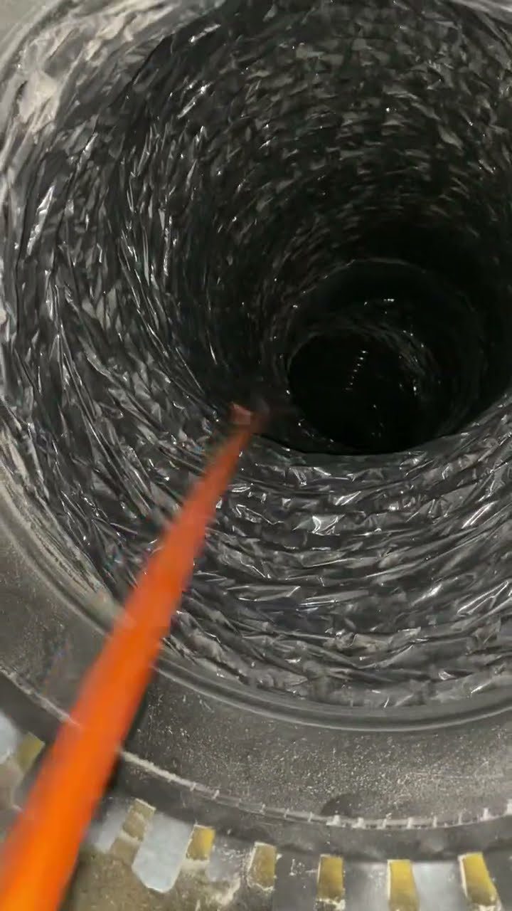 Andrew cleaning a dust filled air duct in a Round Rock home