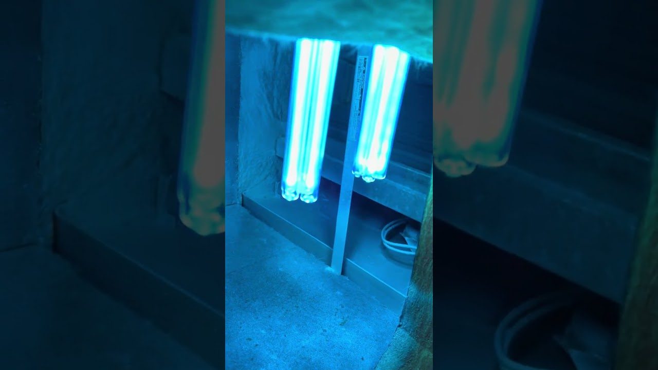 Andrew and Sons installing UV lights after a full air duct cleaning in a Round Rock home