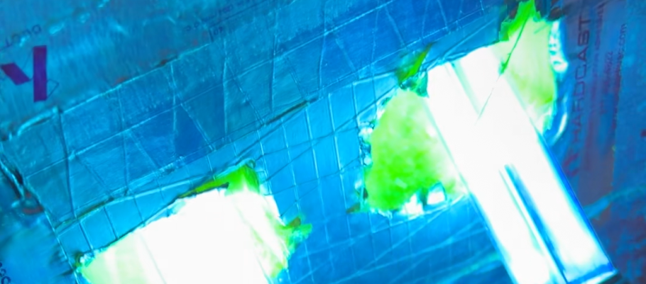 Air purifying UV lamp glowing inside cleaned ductwork in an Austin home