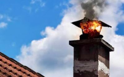 Chimney with smoke during chimney sweep service for safety